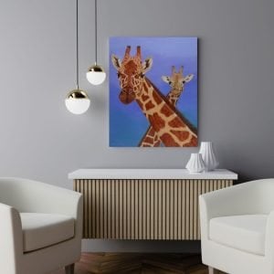 Giraffe original Painting of a mother and her youngster, hanging on a Light grey wall in a living room