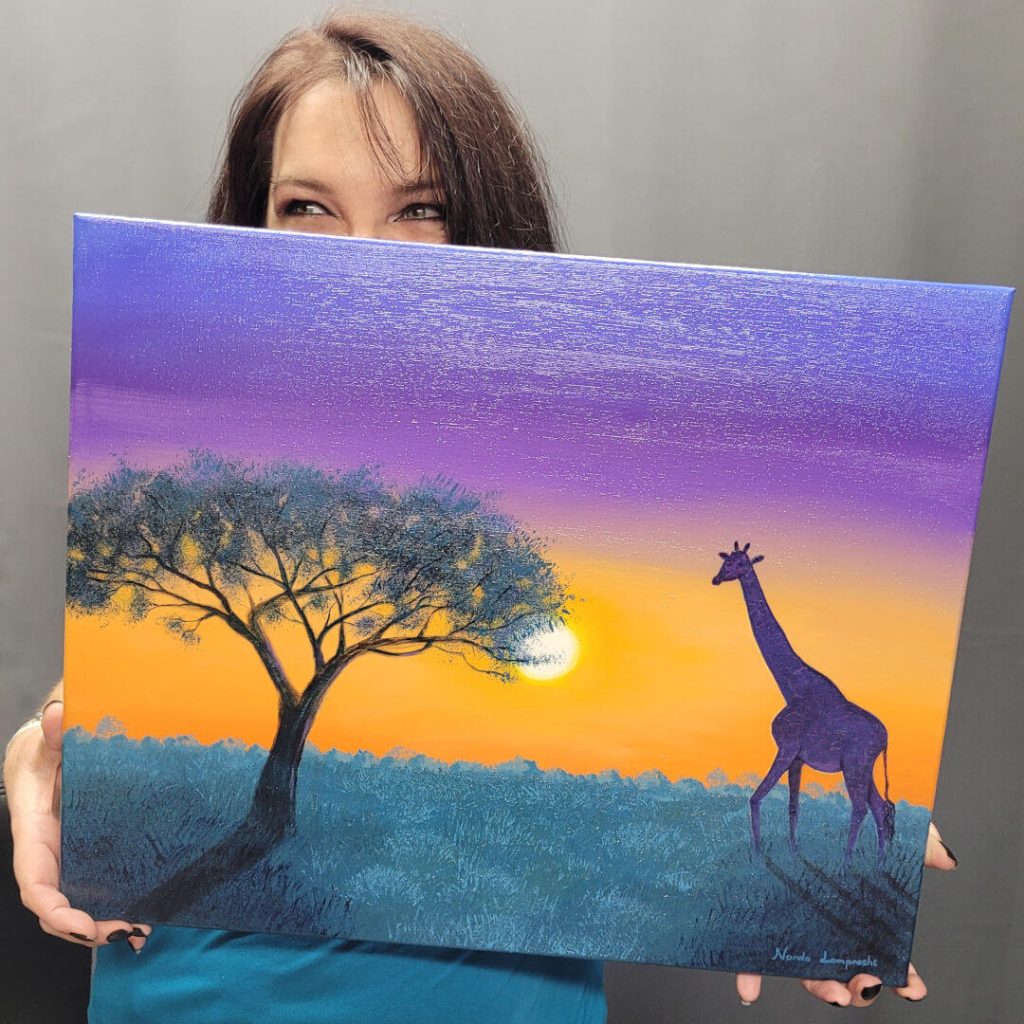 Artist holding her original acrylic painting of giraff at sunset in Africa