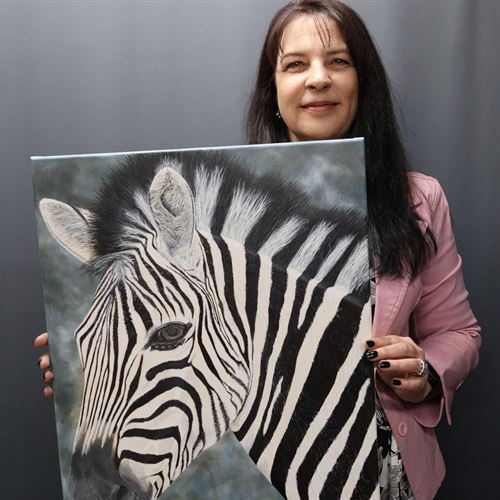 Nanda holding original Zebra painting