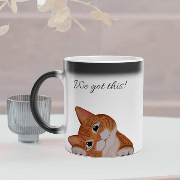 This magic mug changes colour and reveal a cat when filled with hot coffee. It has a ginger cat design and text on both sides of the mug. It is optional to personalize the text.