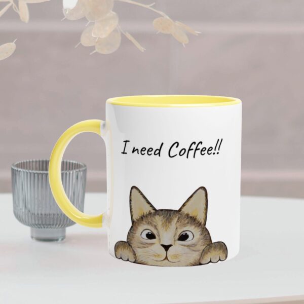 Brown cat mug with yellow colour handle and inside the mug