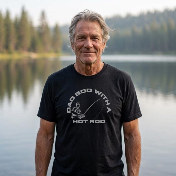 Dad Bod Hot Rod Fishing Tshirt Older Man An older man wearing a black t-shirt with the text "Dad bod with a hot rod" and a graphic of man with a fishing rod. There are 8 t-shirt colour options to choose from.