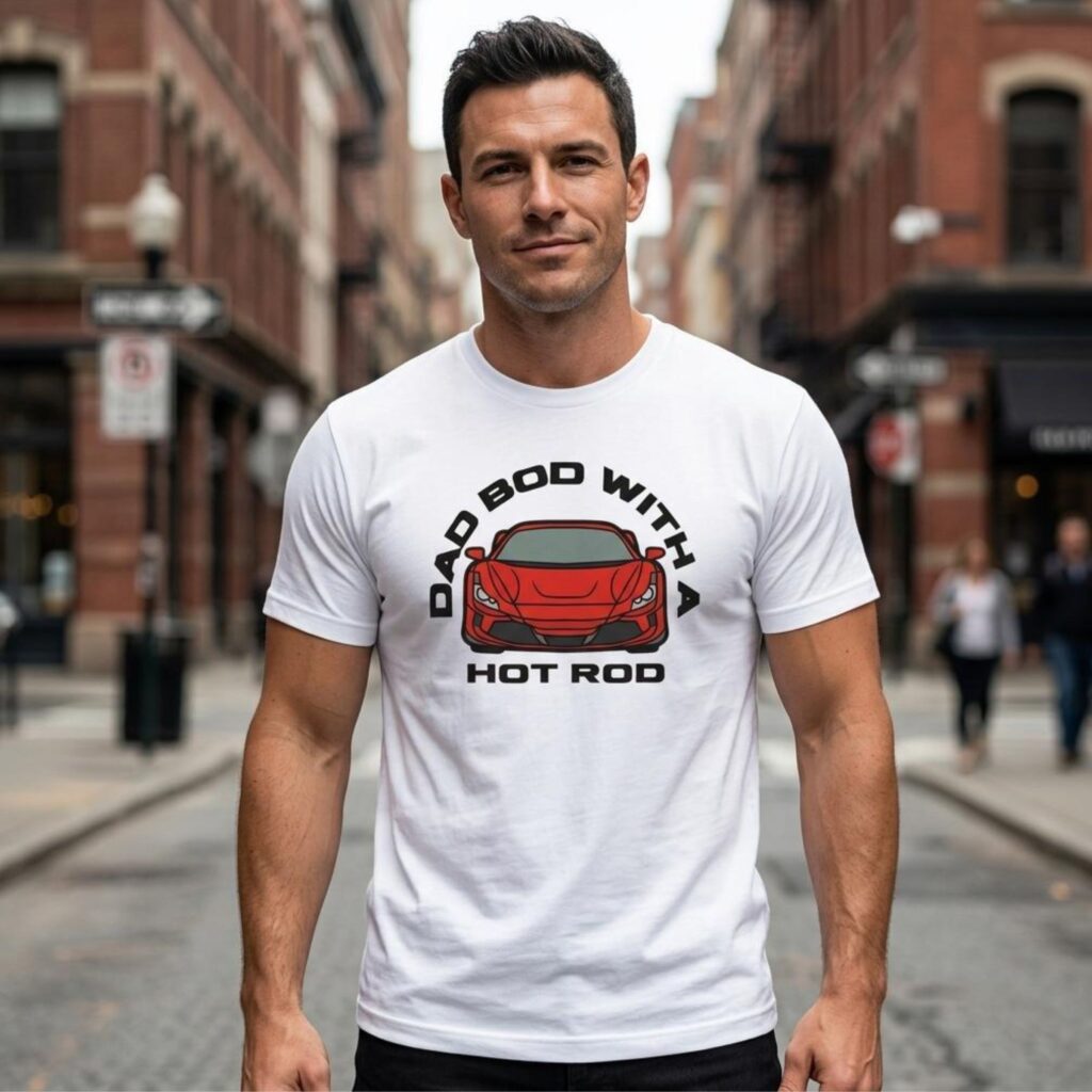 A man wearing a white t-shirt with the text "Dad bod with a hot rod" and a graphic of a car. You can personalize the t-shirt by choosing 1 of 4 different car options.