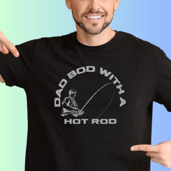 A man wearing a black t-shirt with the text "Dad bod with a hot rod" and a graphic of man with a fishing rod. There are 8 t-shirt colour options to choose from.