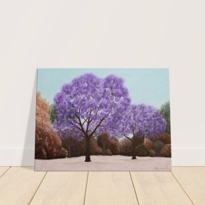 Jacaranda tree canvas print standing on a wooden floor and leaning against the wall.