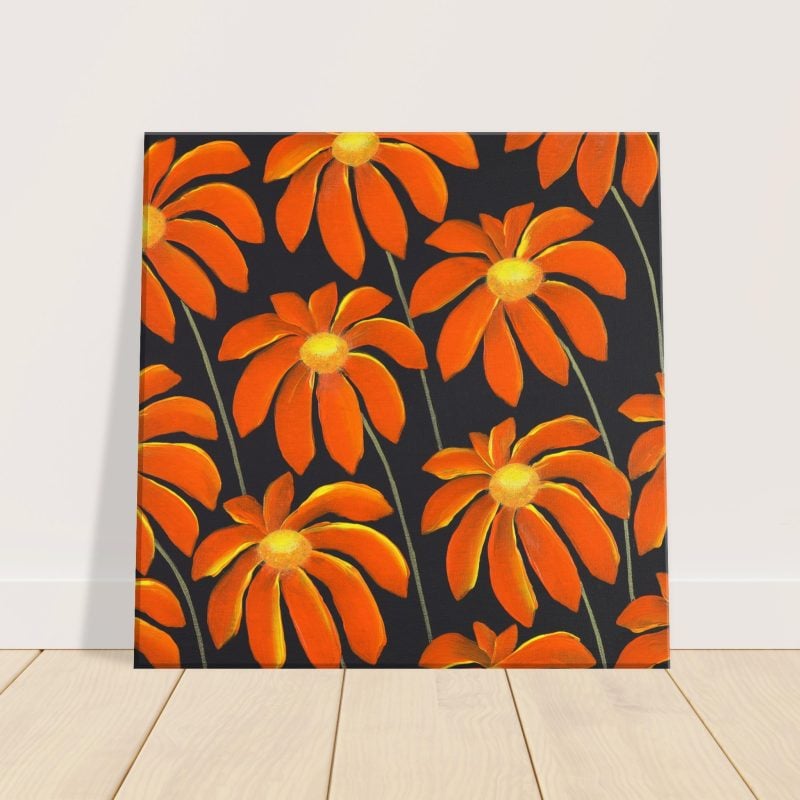 Bright orange daisies on black background canvas print