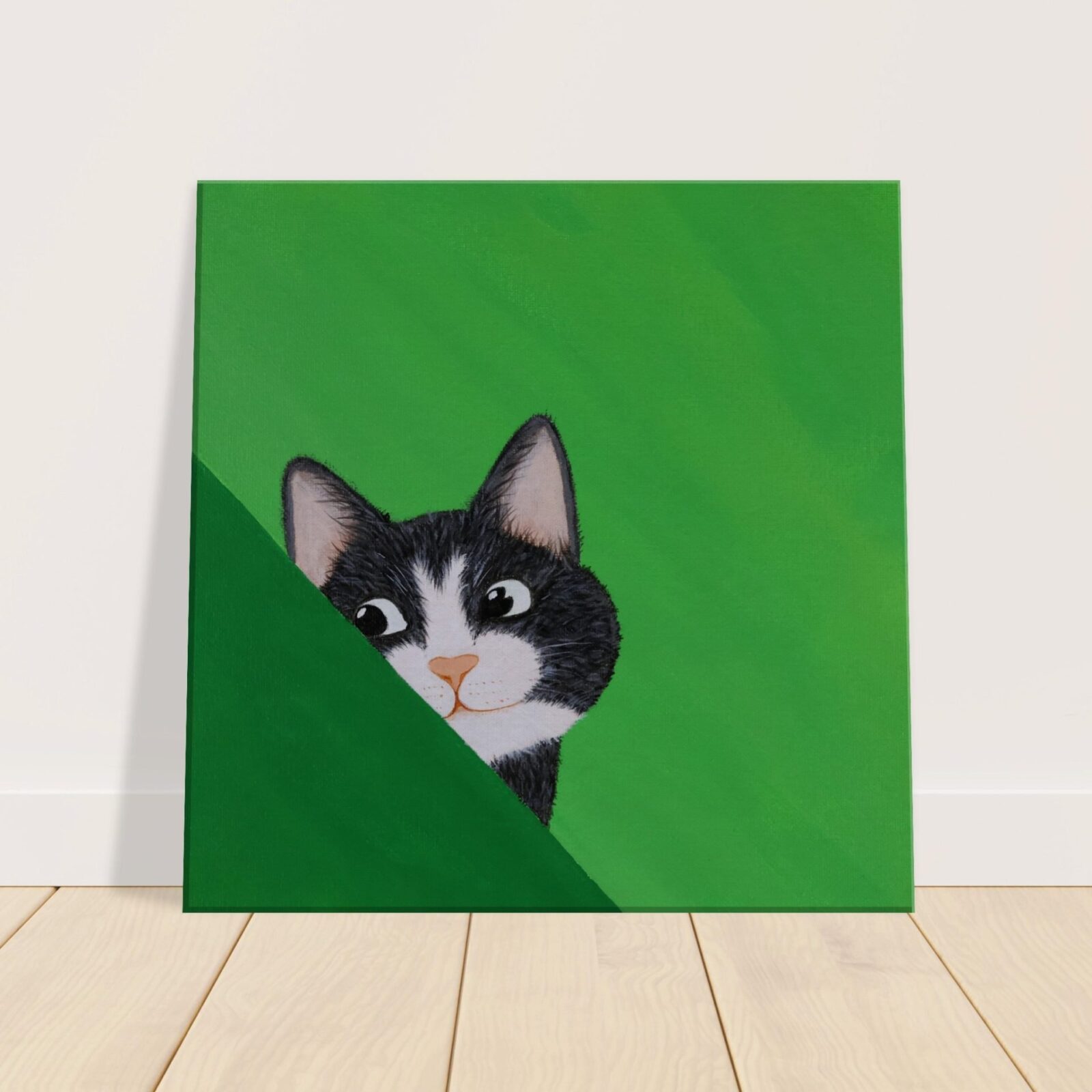 Canvas print of black and white "tuxedo" kitty cat on a green background