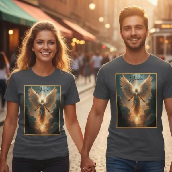 Blessed in JC Couple in City A man and woman, both wearing a dark grey unixes t-shirt with a Angel design. This Christian design includes the work "Blessed" and quote 1 Peter 4:14.