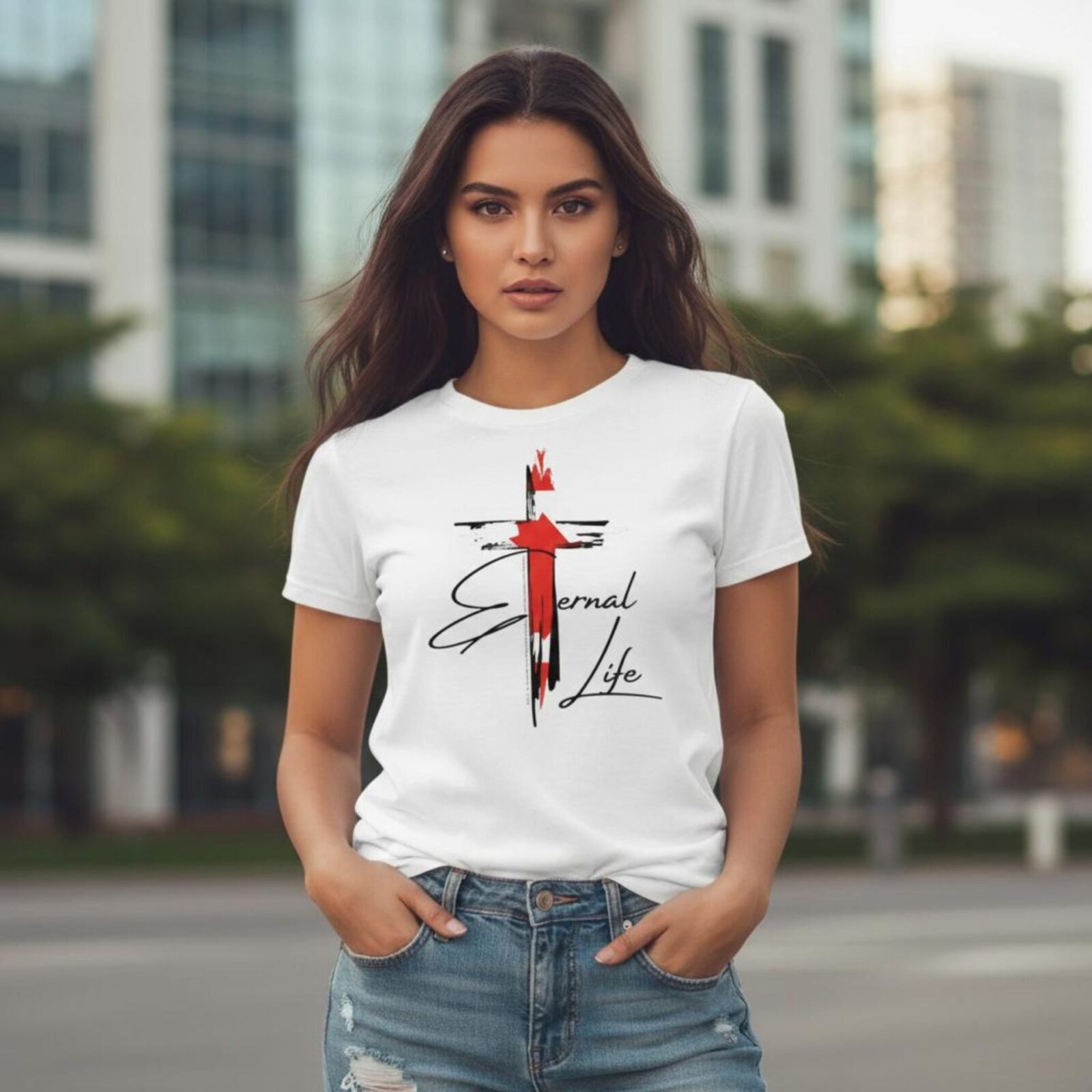 A woman wearing a white unixes t-shirt with a Canadian Cross design. This Christian Cross design with the Canadian flag includes the text "Eternal Life" and quote Galatians 3:11.