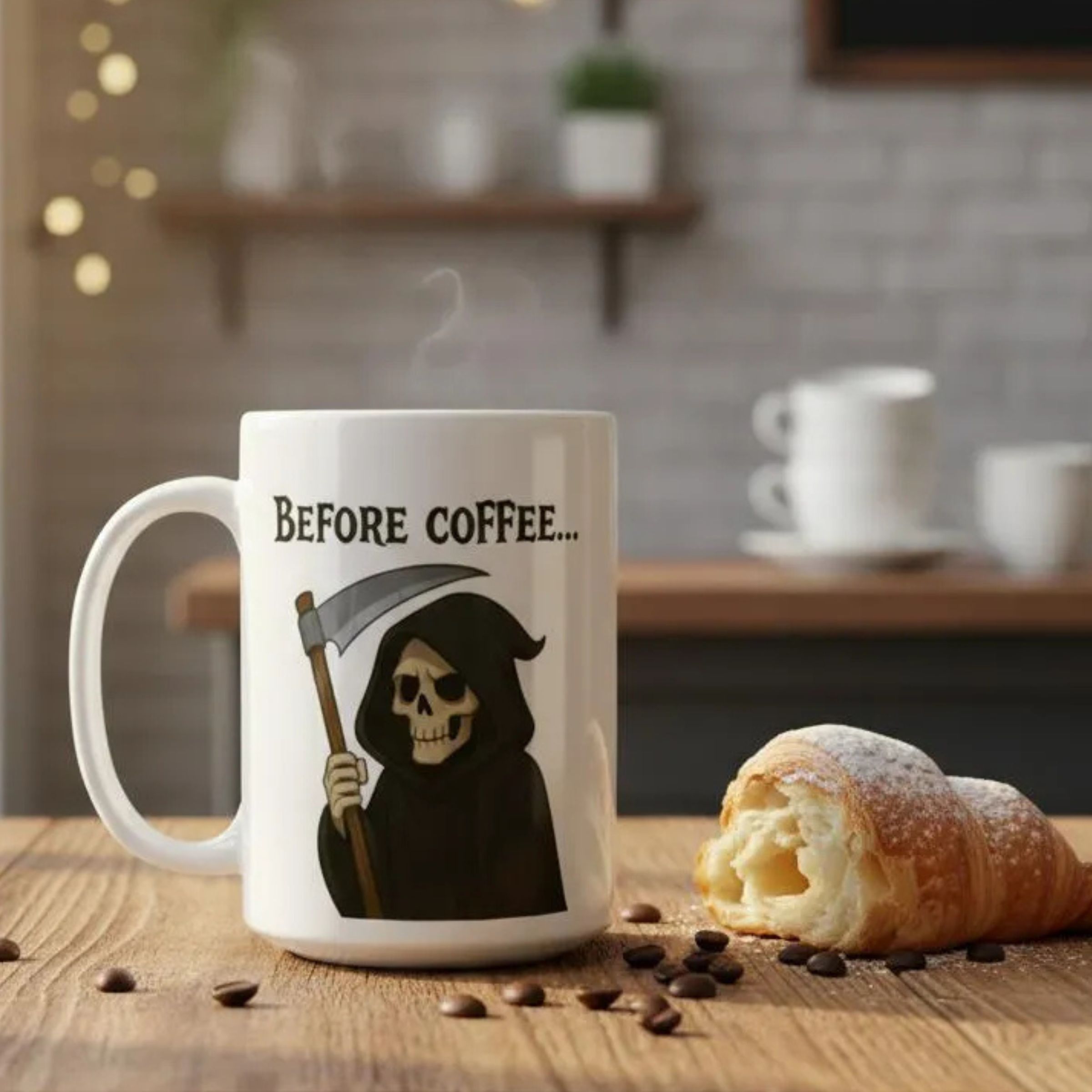 The Grim Reaper coffee mug standing next to a croissant in a coffee shop.
