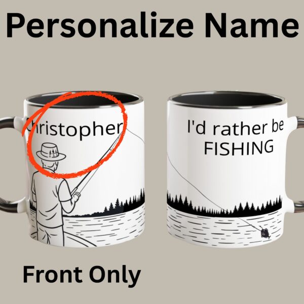 This white mug has a black coloured handle and inside. It has a fisherman design and custom text to personalize it with a person's name on the front of the mug, and on the back it has the text "I'd rather be fishing" which cannot be personalized.