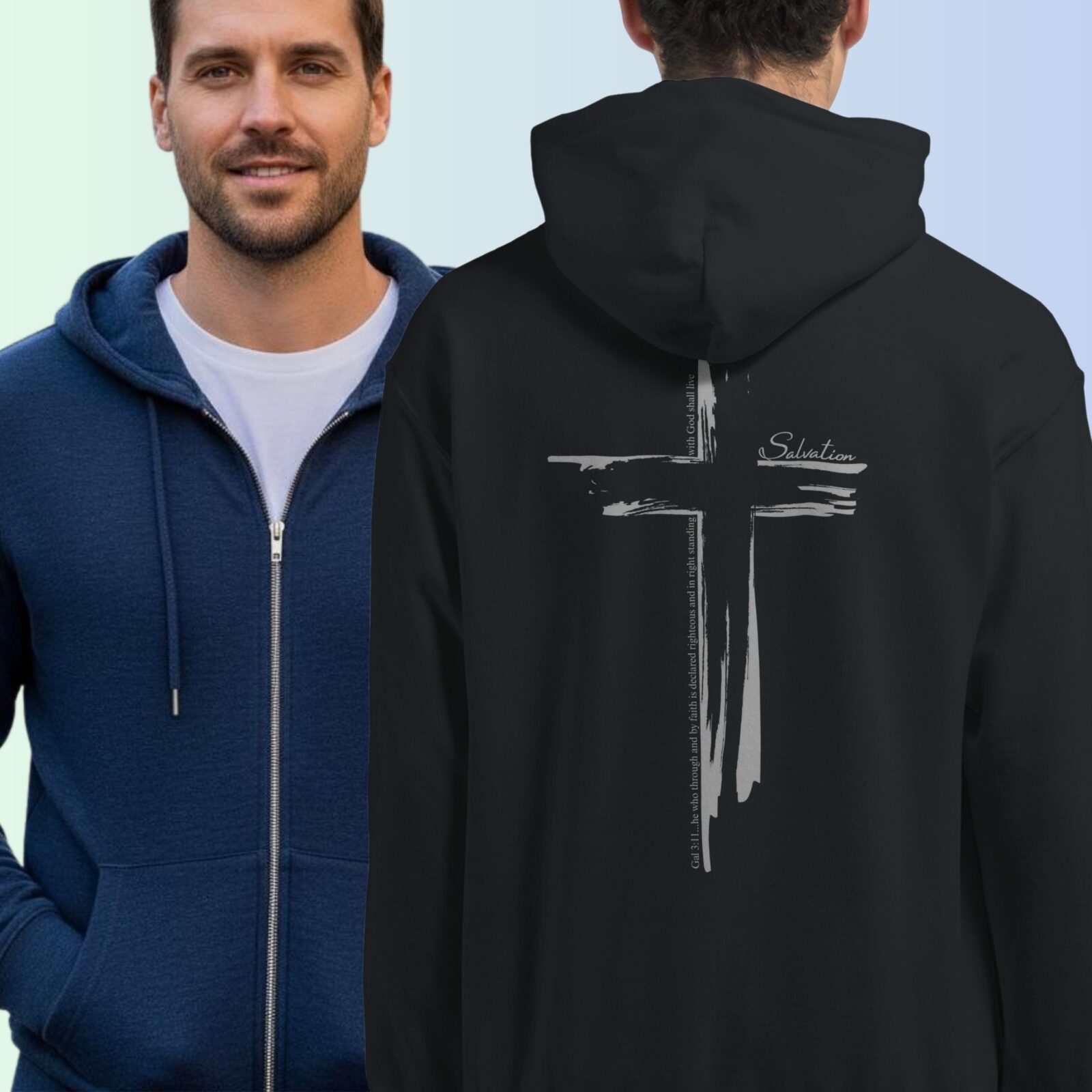 A man wearing a black zip hoodie with a cross design printed on the back. This Christian Cross design includes the text "Salvation" and quote Galatians 3:11. The second man is wearing a navy zip hoodie, showing the front of the hoodie which has no print on the front.