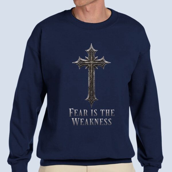 A Man wearing the "Fear is the Weakness" unisex sweatshirt.