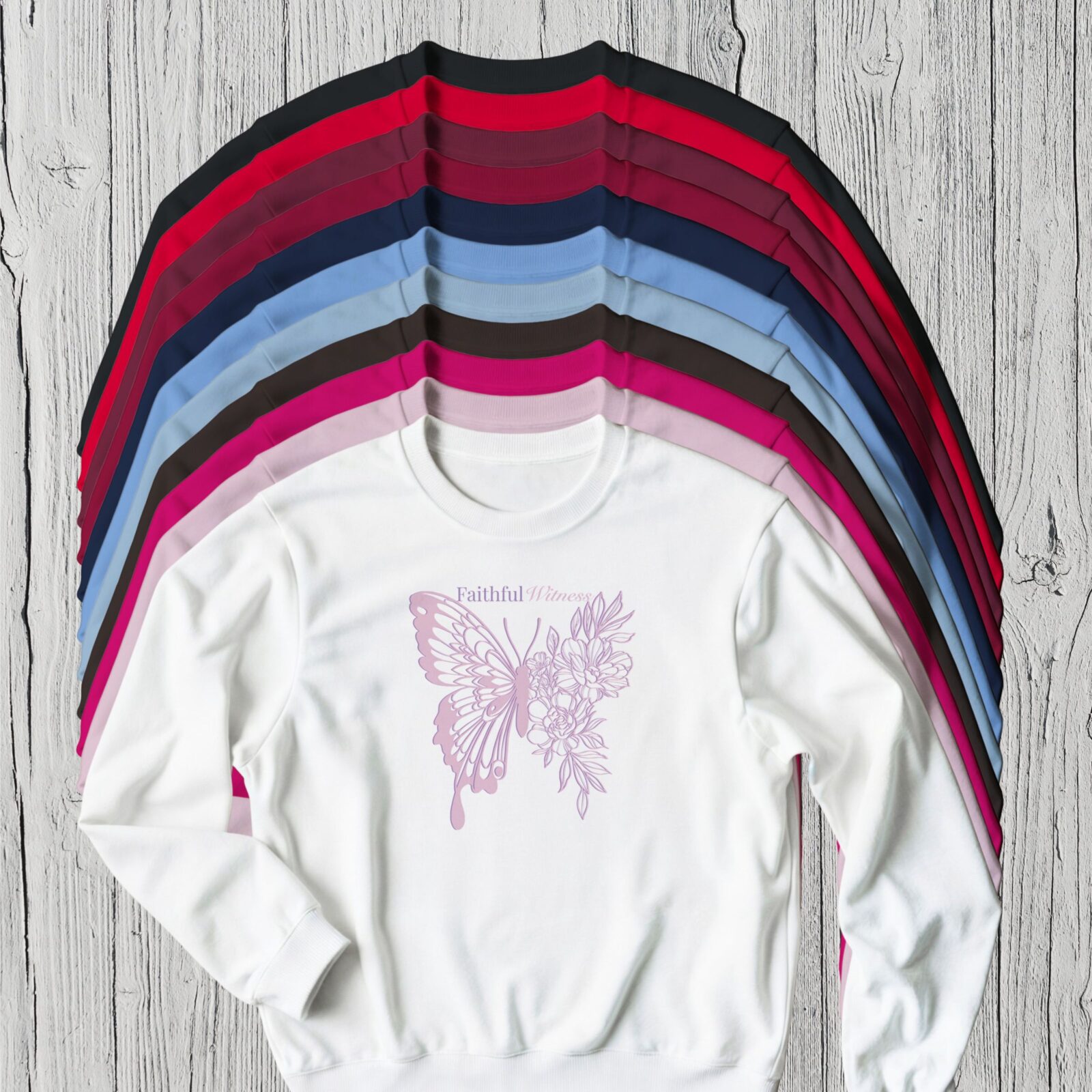 There are 11 colour options for the sweatshirt: black, red, maroon, Cardinal red, navy, Carolina blue, light blue, dark chocolate, heliconia pink, light pink, and white.