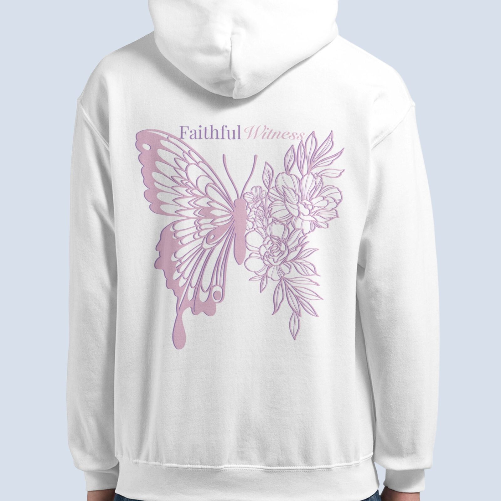 A woman wearing a white pullover hoodie with a butterfly and flower design, and the text "Faithful Witness".
