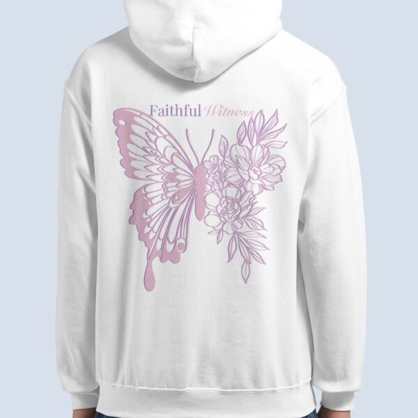 A woman wearing a white pullover hoodie with a butterfly and flower design, and the text "Faithful Witness".