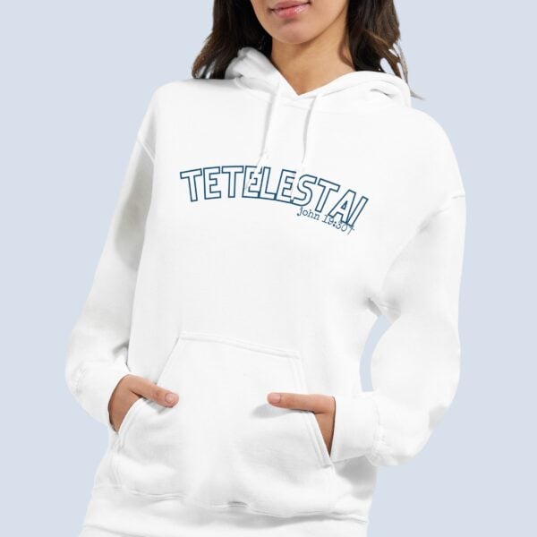 A woman wearing a white unisex pullover hoodie with the text "Tetelestai" and "John 19:30" printed on the front.