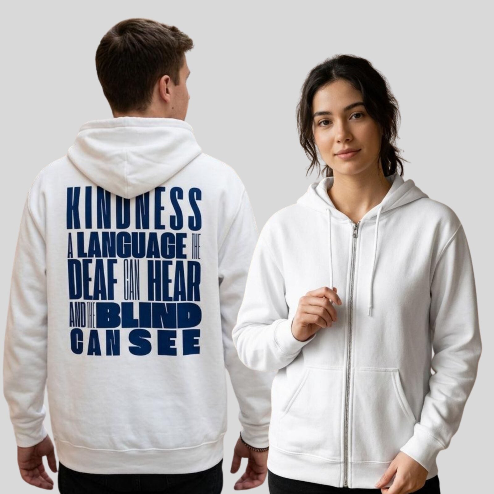 A man and a woman, both wearing a white unisex full zip up hoodie with an inspirational message "Kindness, a language the deaf can hear and the blind can see". The design on this Christian hoodie is printed on the back of the hoodie only.